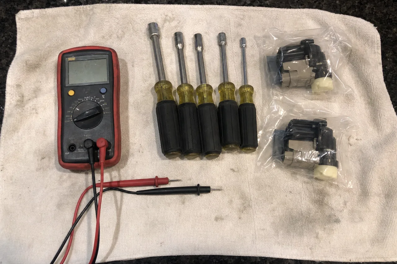 A commercial repair technician's tools laid out